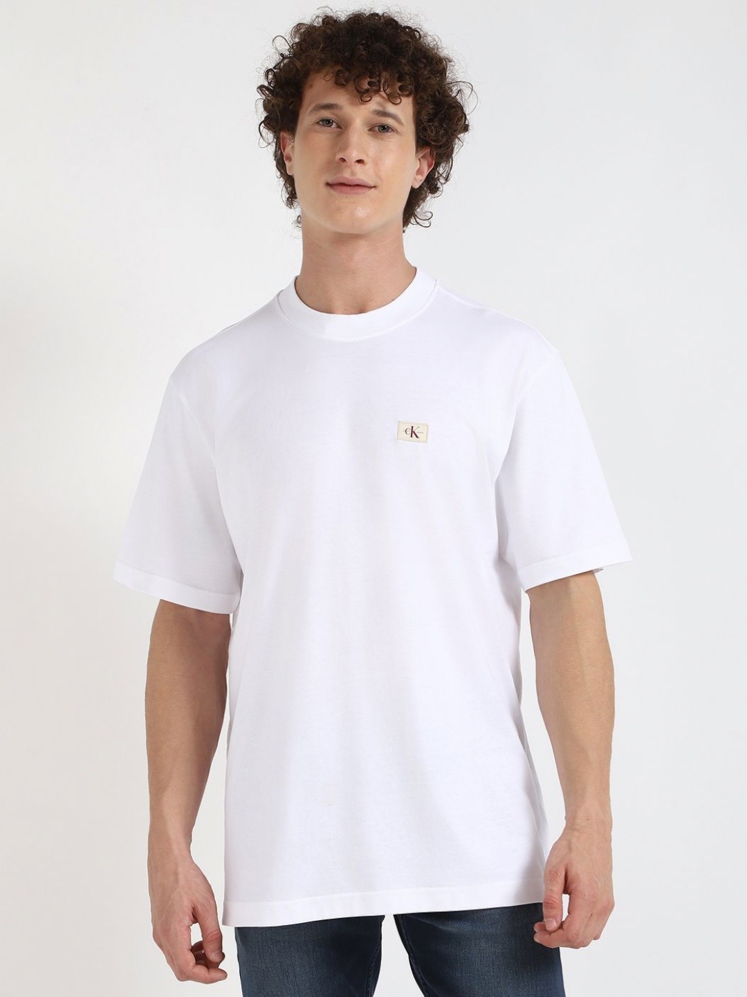 

Calvin Klein Jeans Men Solid Round Neck Cotton T-shirt, White