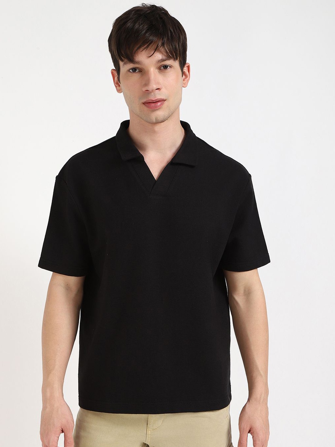 

Calvin Klein Jeans Men Solid Polo Collar Cotton T-shirt, Black
