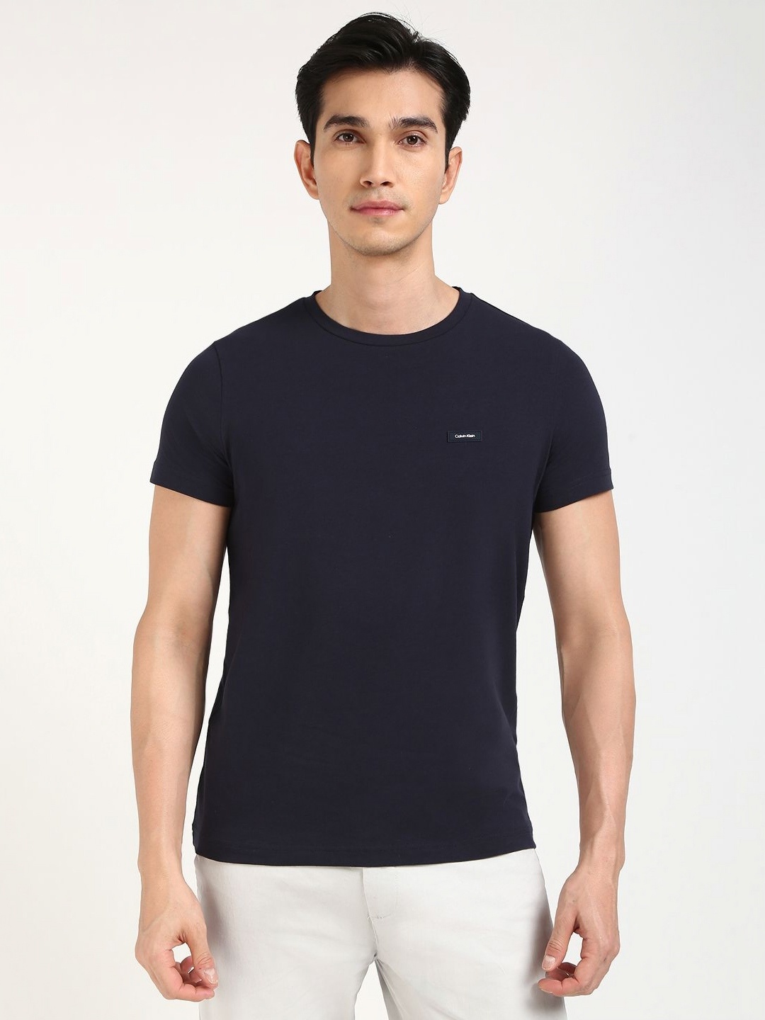 

Calvin Klein Jeans Men Solid Round Neck Cotton T-shirt, Navy blue