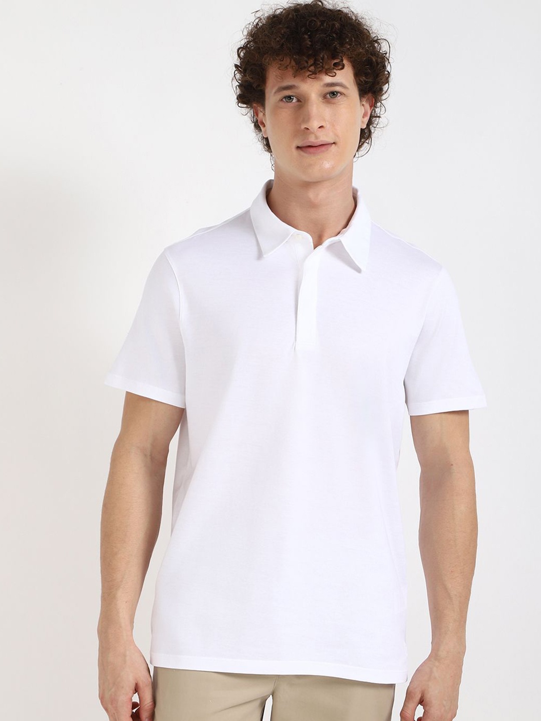 

Calvin Klein Jeans Men Solid Polo Collar Cotton T-shirt, White