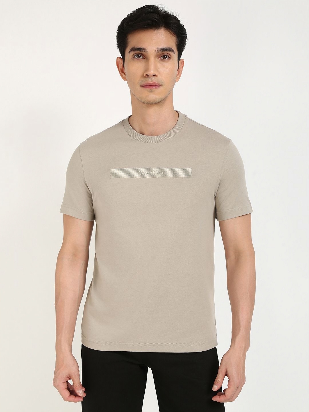 

Calvin Klein Jeans Men Solid Round Neck Cotton T-shirt, Beige