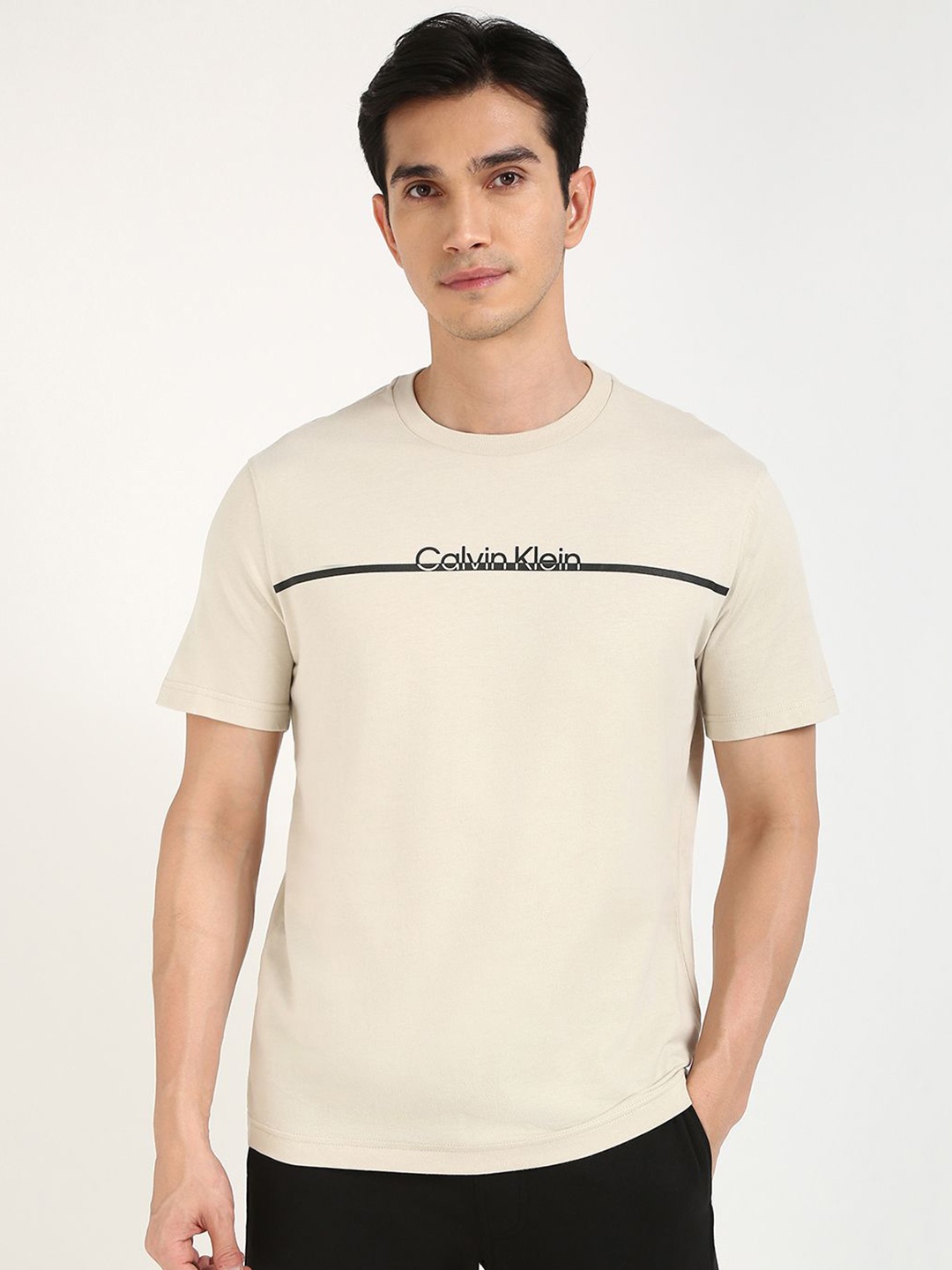 

Calvin Klein Jeans Men Typography Printed Round Neck Cotton T-shirt, Beige