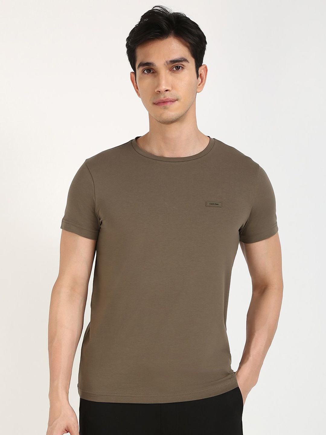 

Calvin Klein Jeans Men Solid Round Neck Cotton T-shirt, Beige