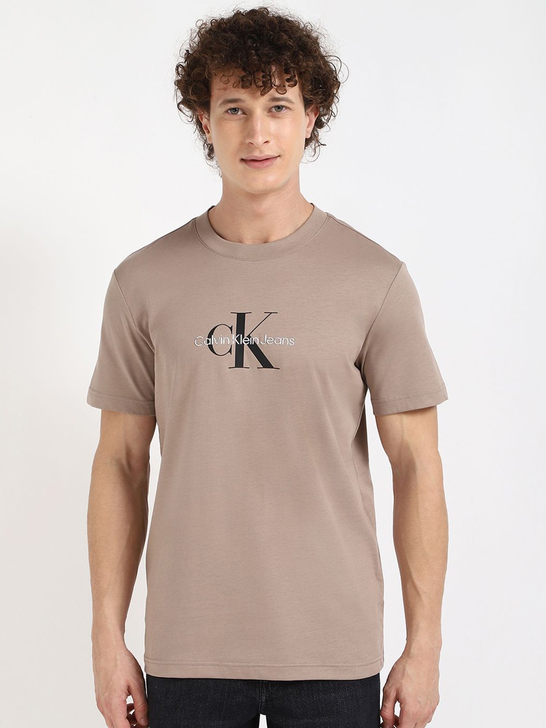 

Calvin Klein Jeans Men Typography Printed Round Neck Cotton T-shirt, Beige