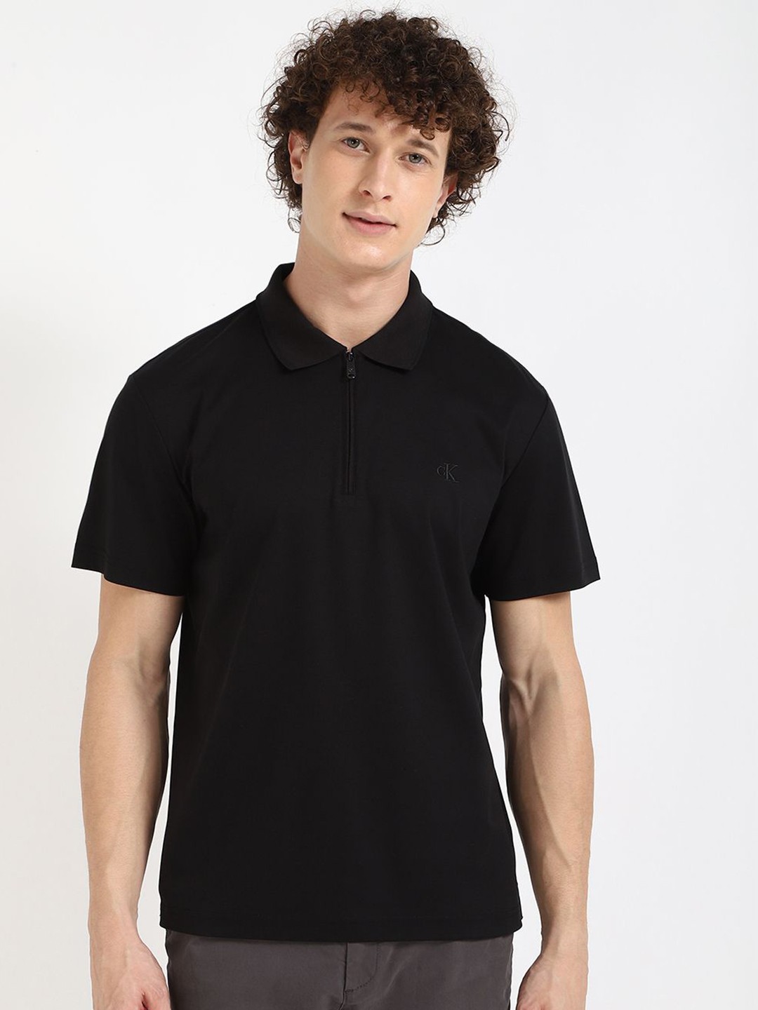 

Calvin Klein Jeans Men Solid Polo Collar Cotton T-shirt, Black