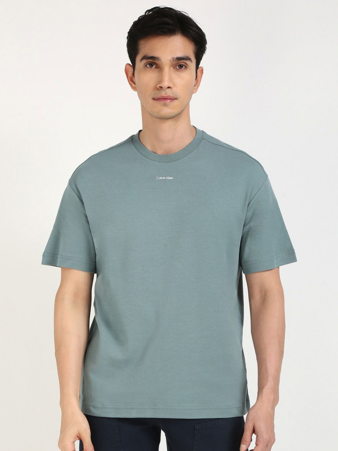 

Calvin Klein Jeans Men Solid Round Neck Cotton Relaxed Fit T-shirt, Blue