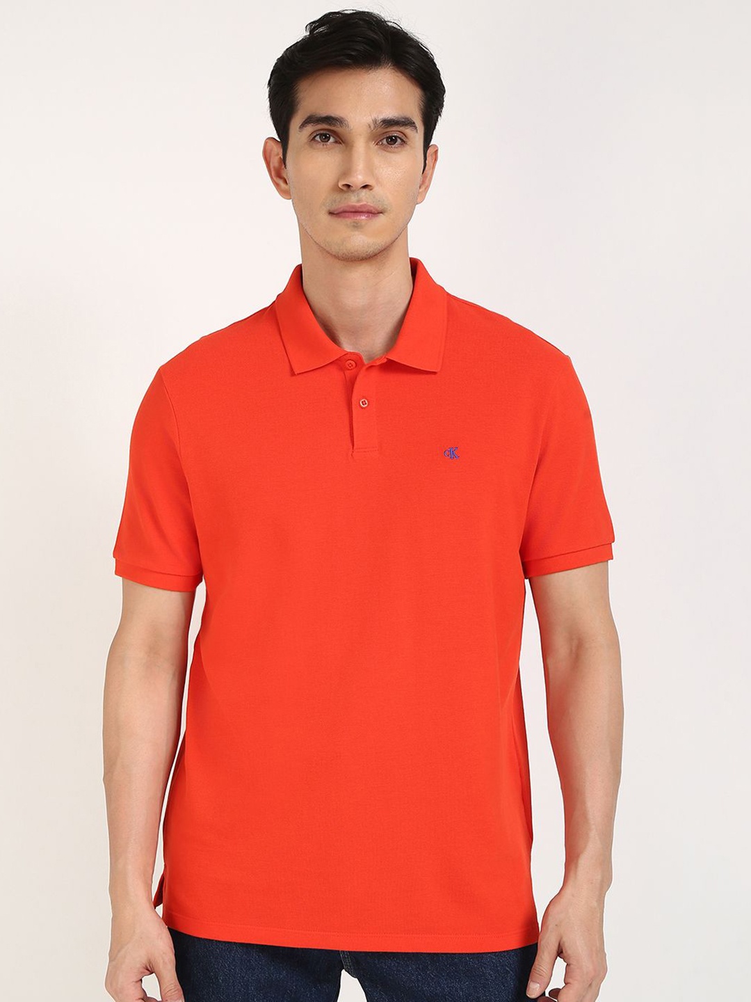 

Calvin Klein Jeans Men Solid Polo Collar Cotton T-shirt, Orange