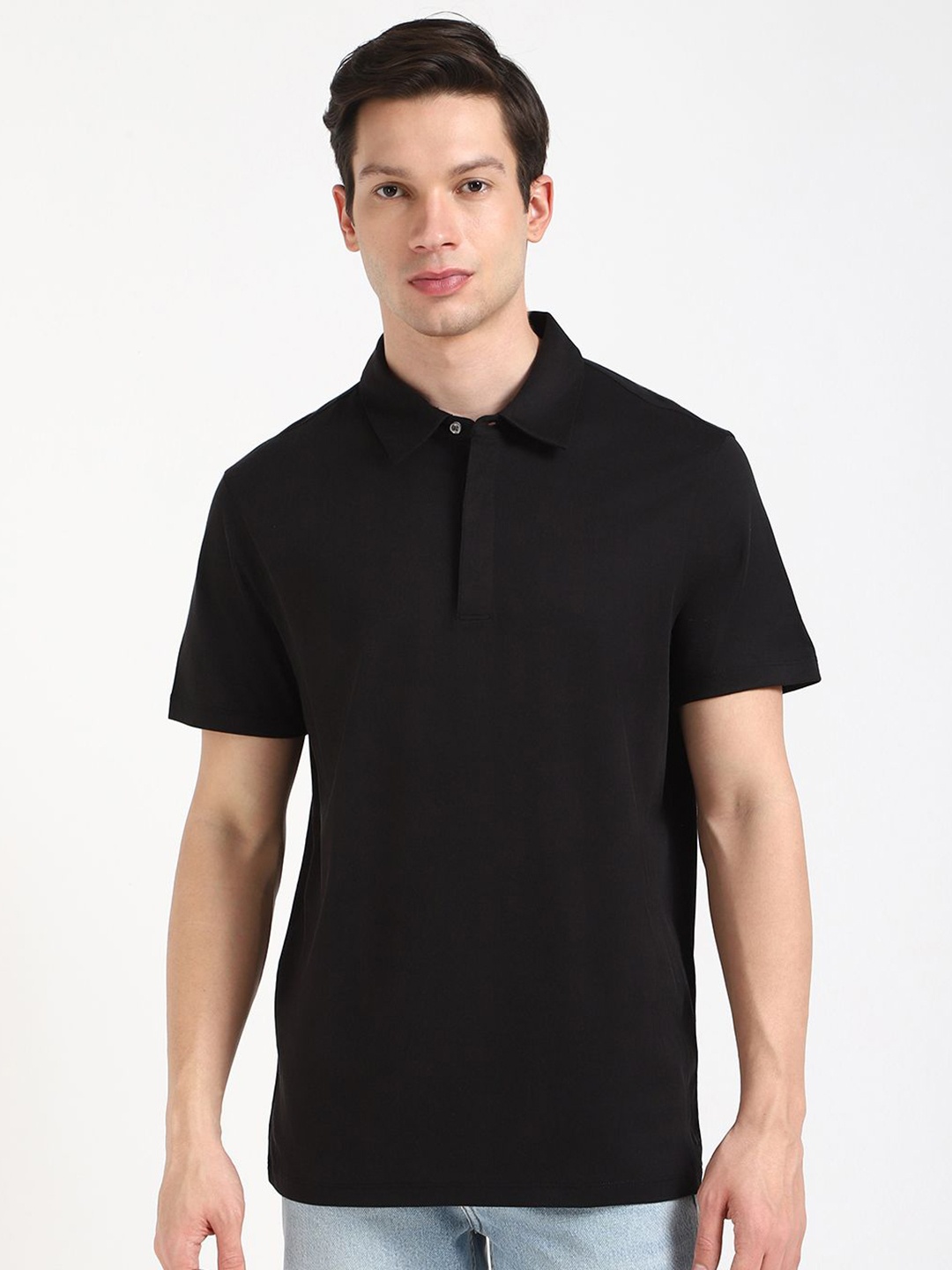 

Calvin Klein Jeans Men Solid Polo Collar Cotton T-shirt, Black