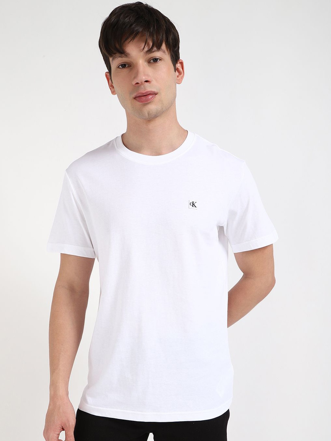 

Calvin Klein Jeans Men Solid Round Neck Cotton T-shirt, White