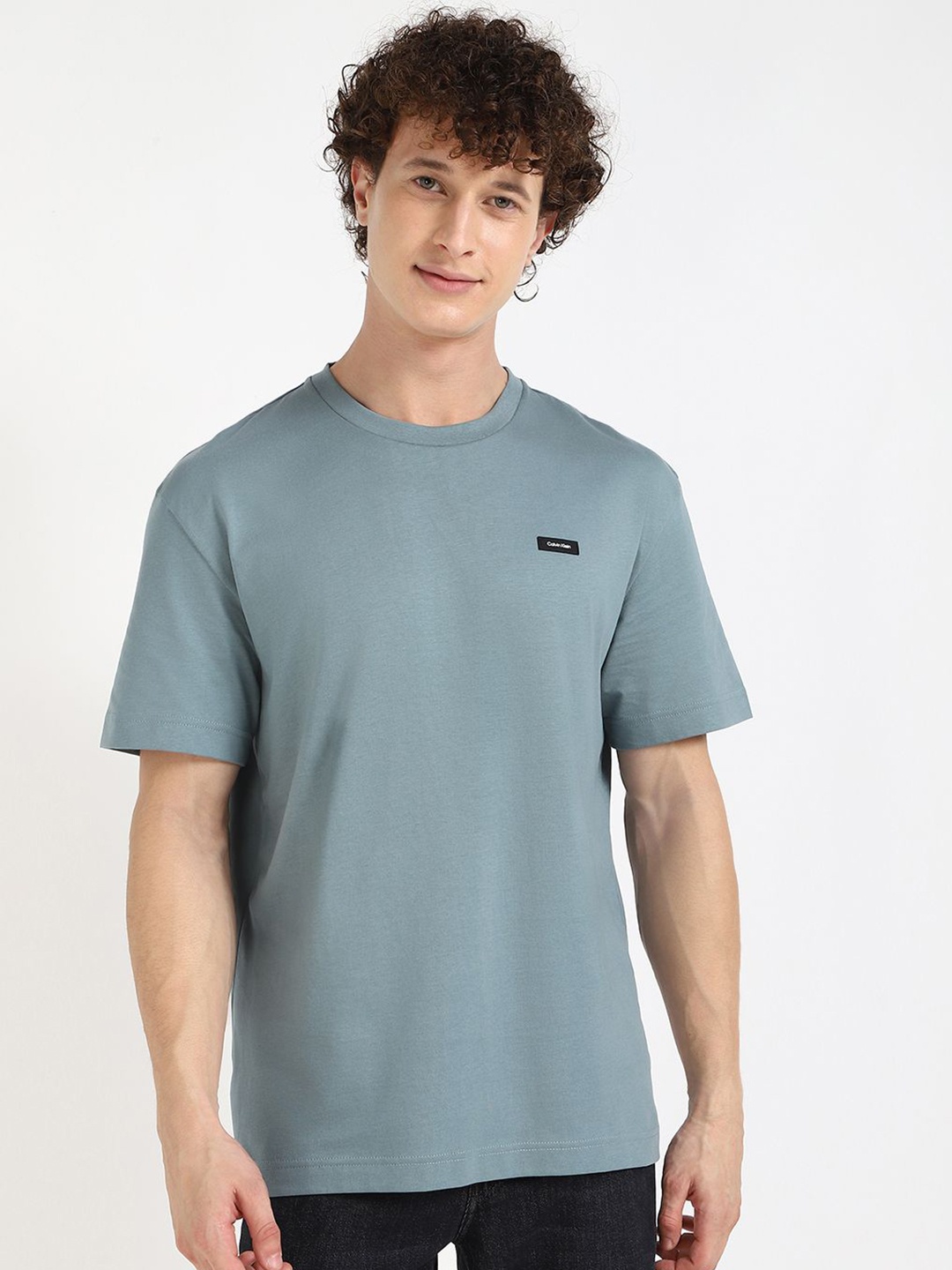 

Calvin Klein Jeans Men Solid Round Neck Cotton T-shirt, Blue