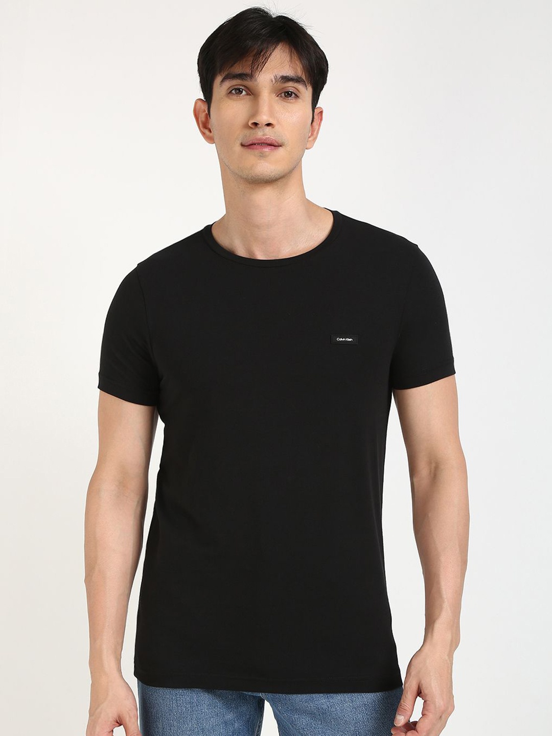 

Calvin Klein Jeans Men Solid Round Neck Cotton T-shirt, Black