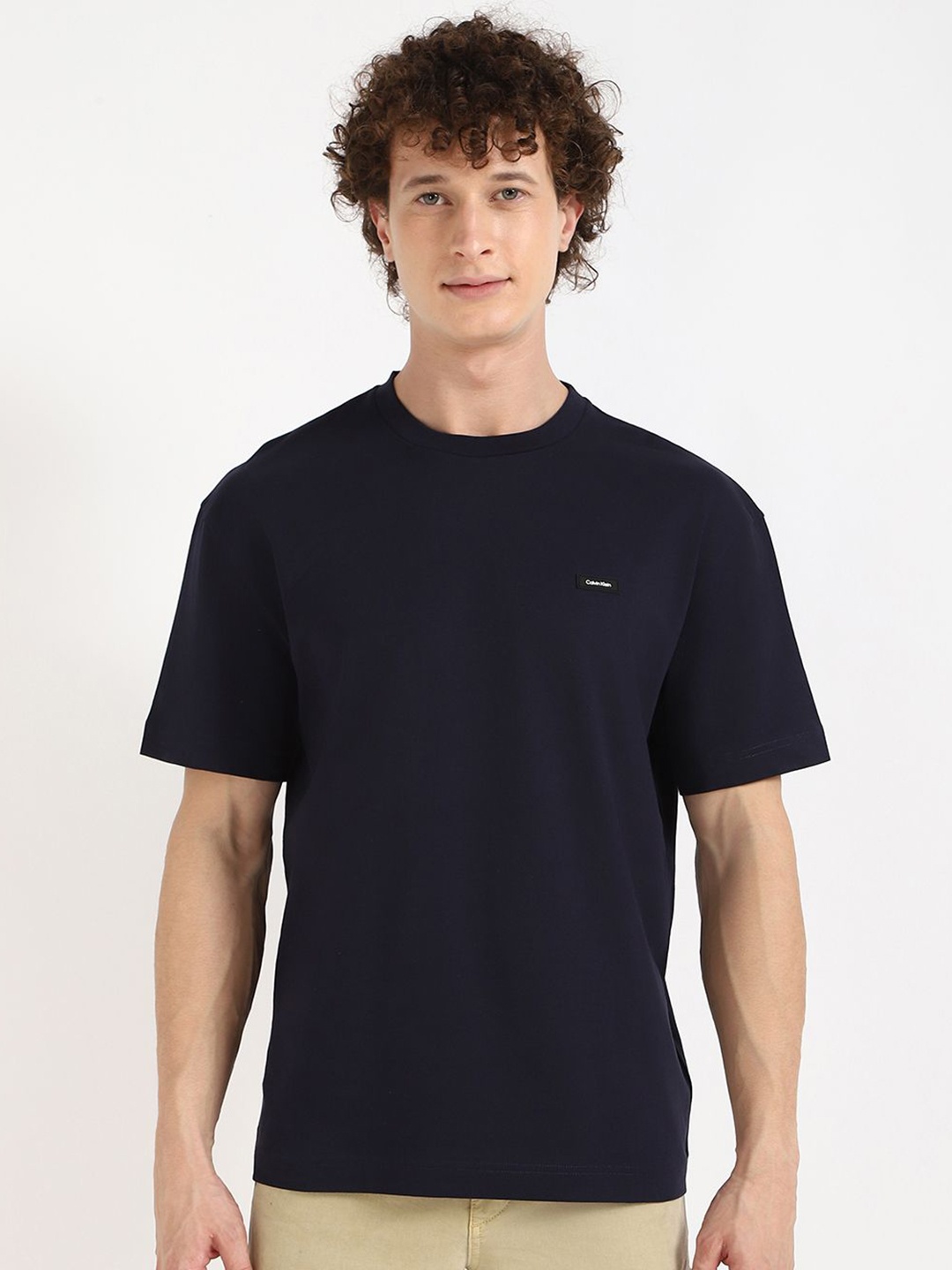 

Calvin Klein Jeans Men Solid Round Neck Cotton T-shirt, Navy blue