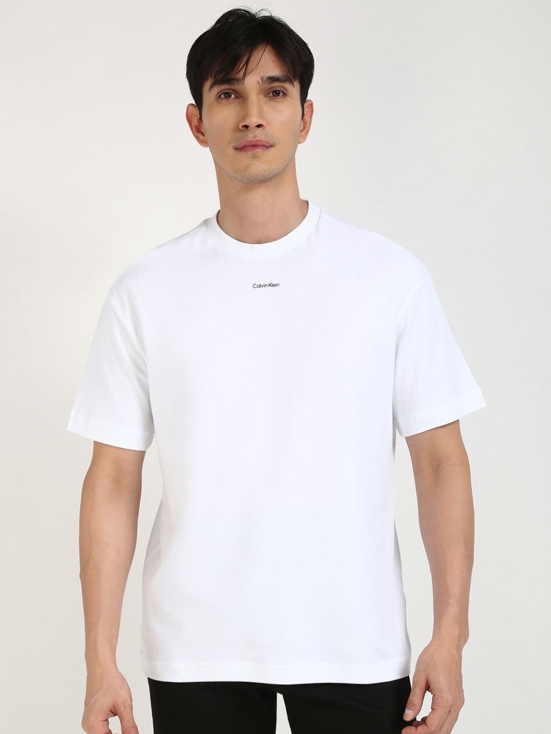 

Calvin Klein Jeans Men Solid Round Neck Cotton T-shirt, White