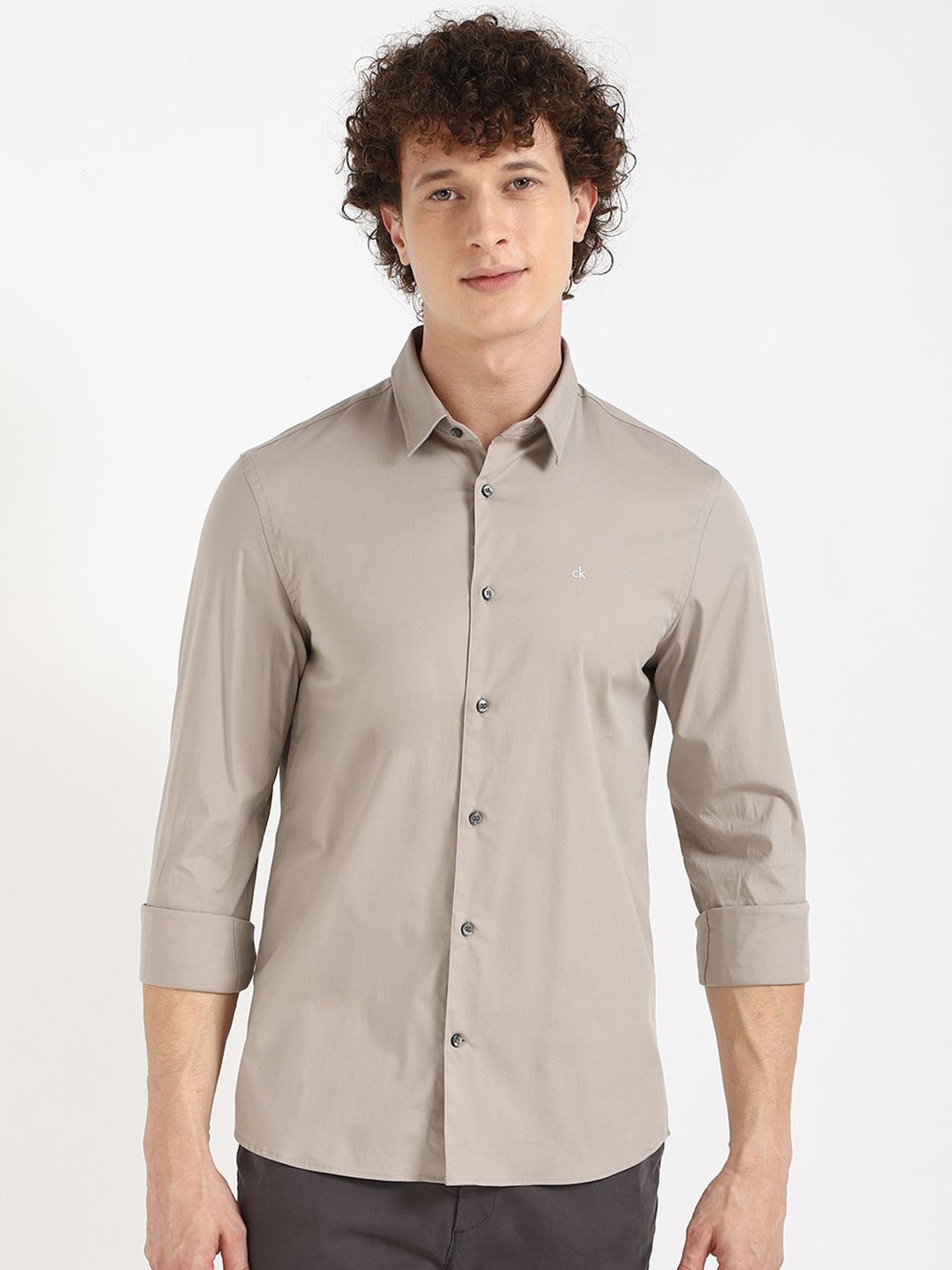 

Calvin Klein Jeans Men Spread Collar Solid Cotton Casual Shirt, Beige