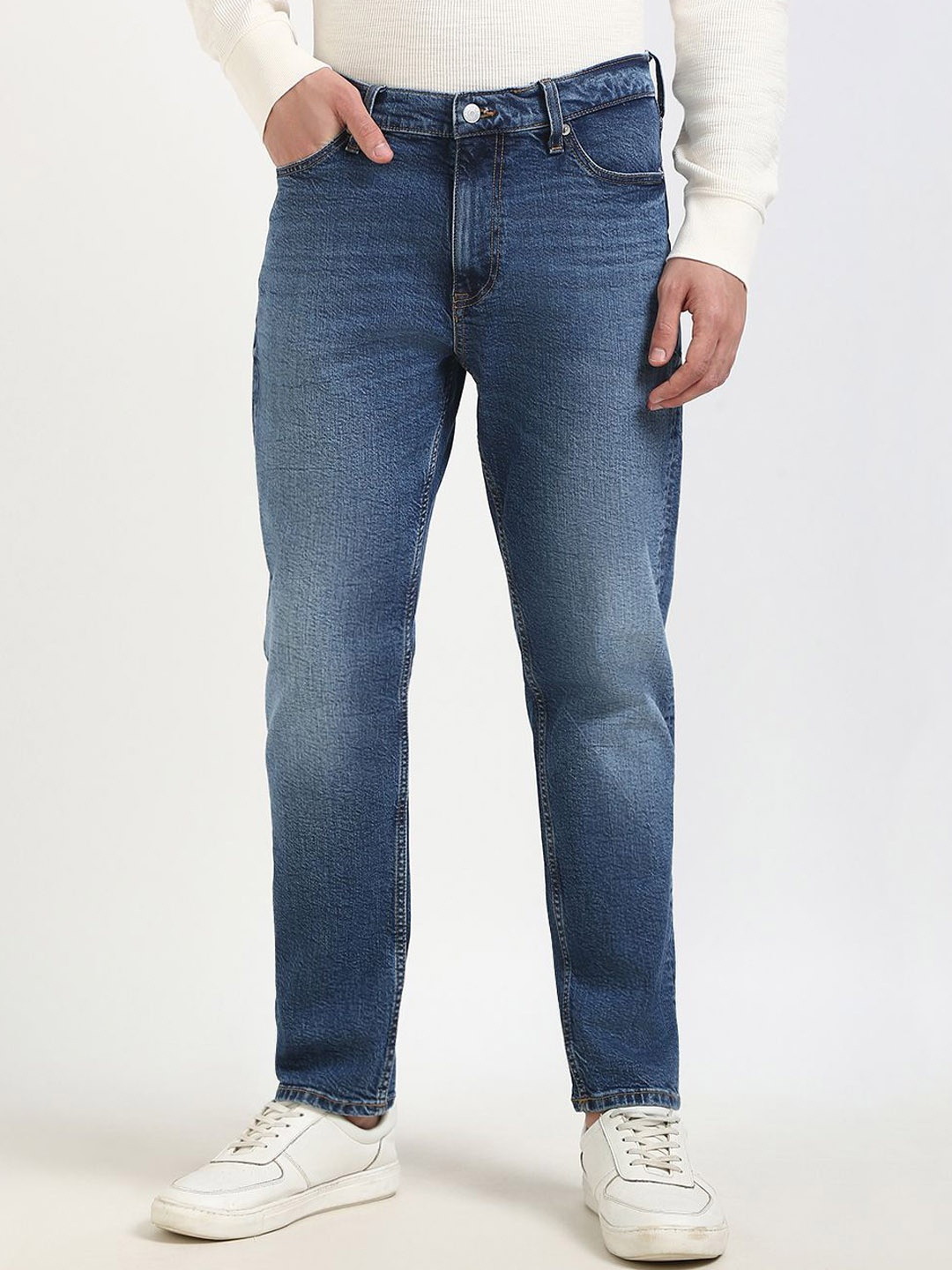 

Tommy Hilfiger Men Mid-Rise Tapered Fit Light Fade Jeans, Blue