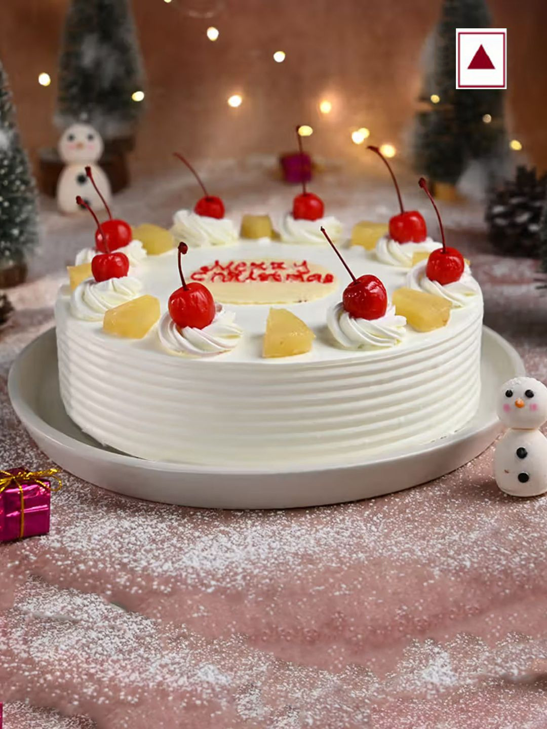 

Floweraura Christmas Cherry Pineapple Flavour Eggless Round Shape Cake - 1 Kg, White