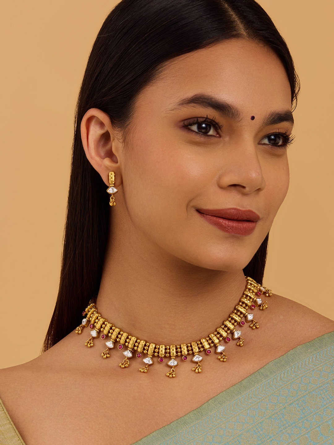 

Kushal's Fashion Jewellery Gold-Plated Ruby Stone Studded Antique Jewellery Set