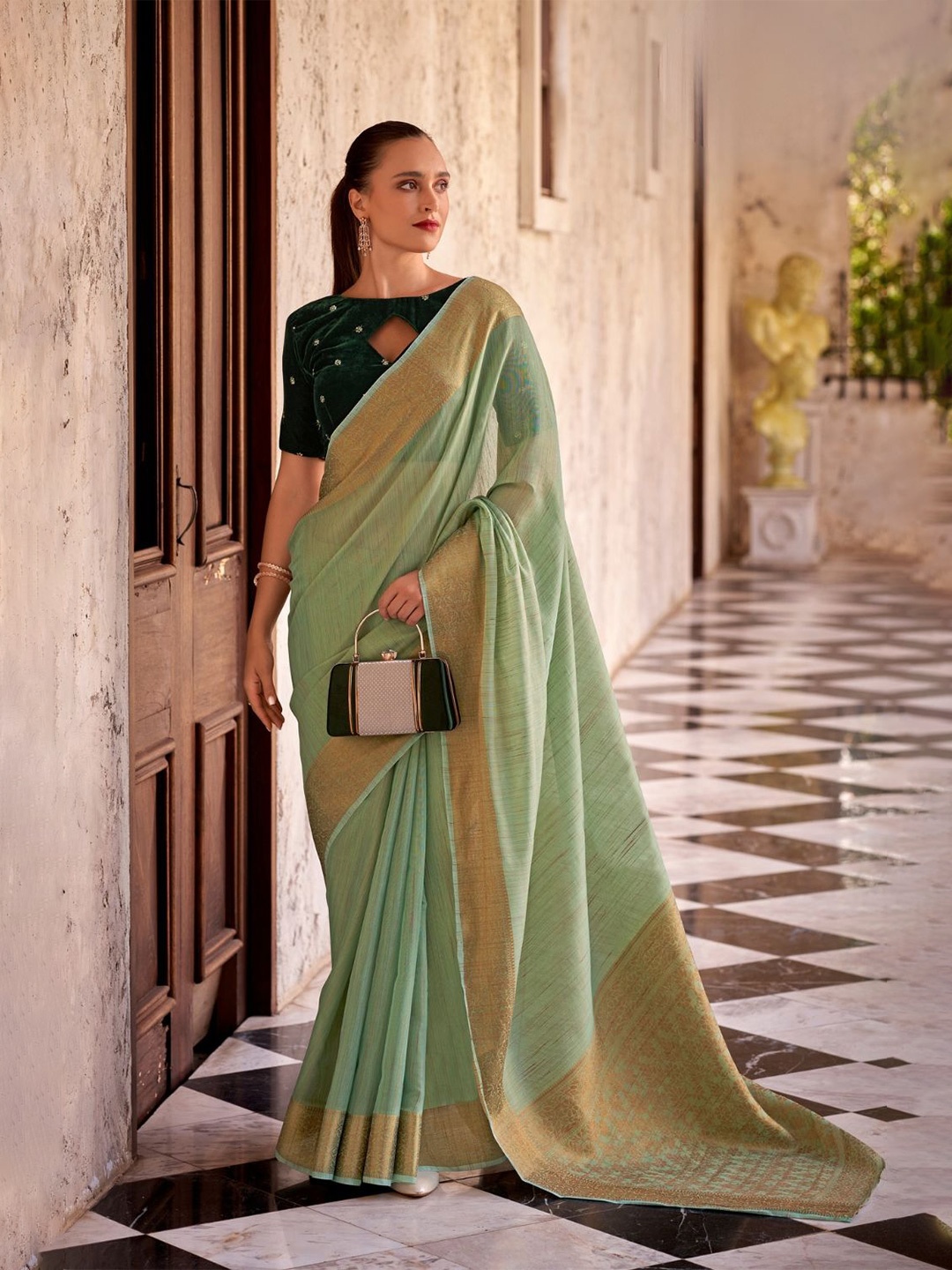 

DEVATITHI Woven Design Green Tissue Linen With Zari Weaving Saree