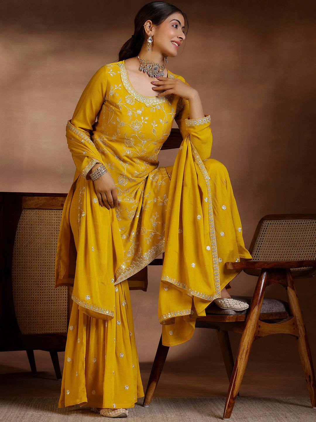 

Libas Floral Embroidered Regular Sequinned Kurta with Sharara & Dupatta, Mustard