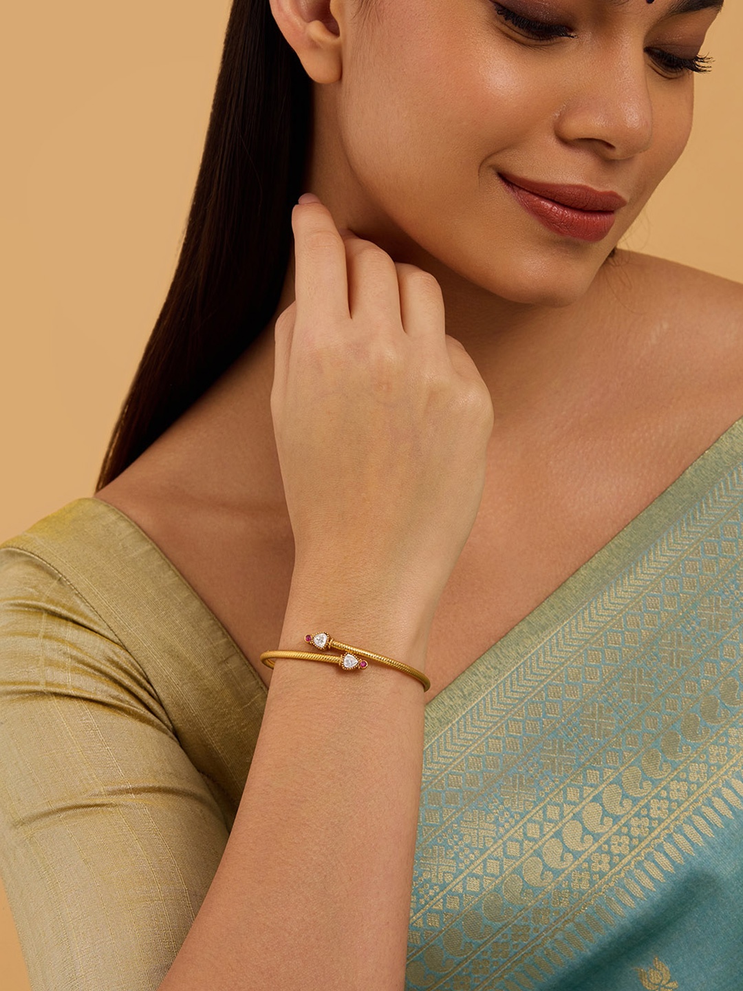 

Kushal's Fashion Jewellery Gold-Plated Artificial Stones Studded Antique Kada