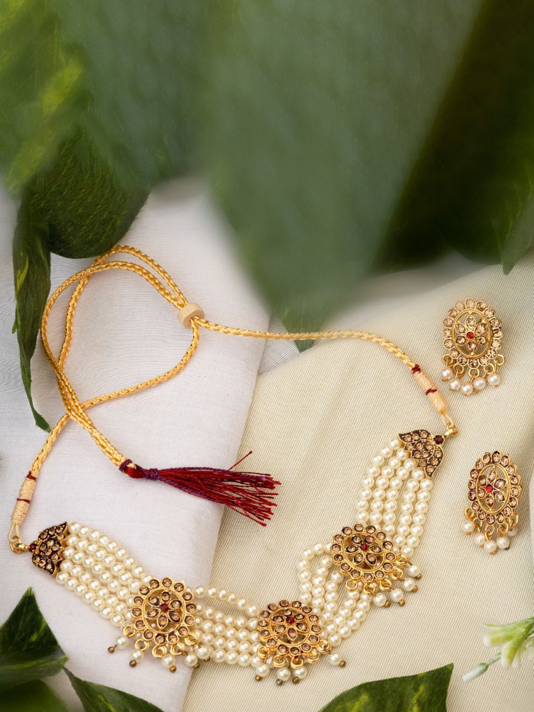 

TONOLIKA Gold Plated Stones Studded & Beaded Jewellery Set
