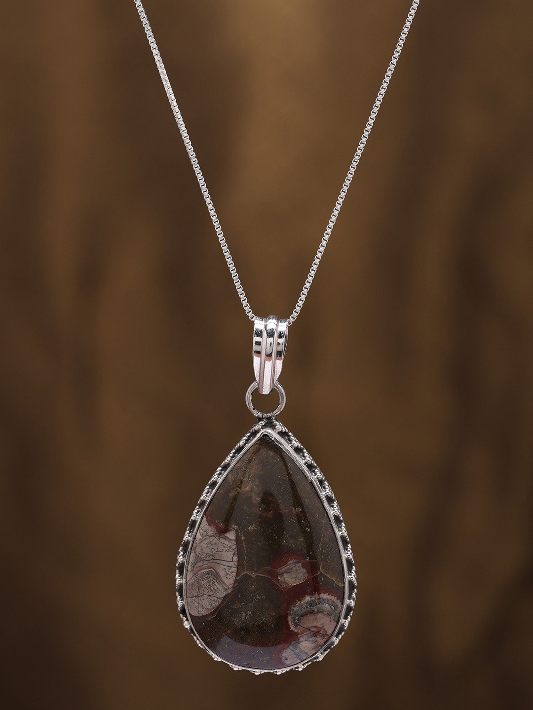 

Exotic India Sterling Silver Pendant with Teardrop Shaped Mushroom Jasper, Brown