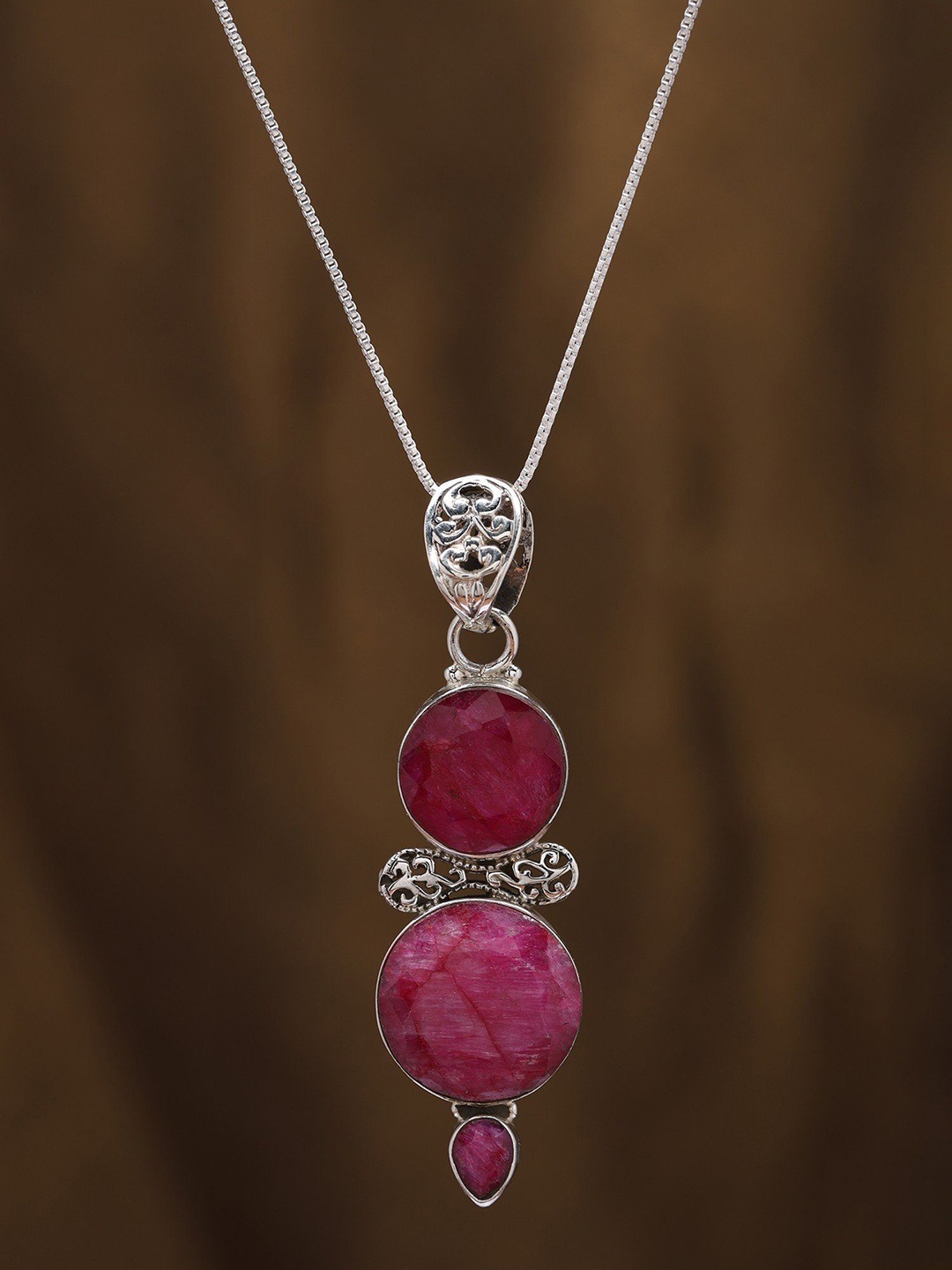 

Exotic India Sterling Silver Pendant with Faceted Round Shape Duplet Ruby, Pink