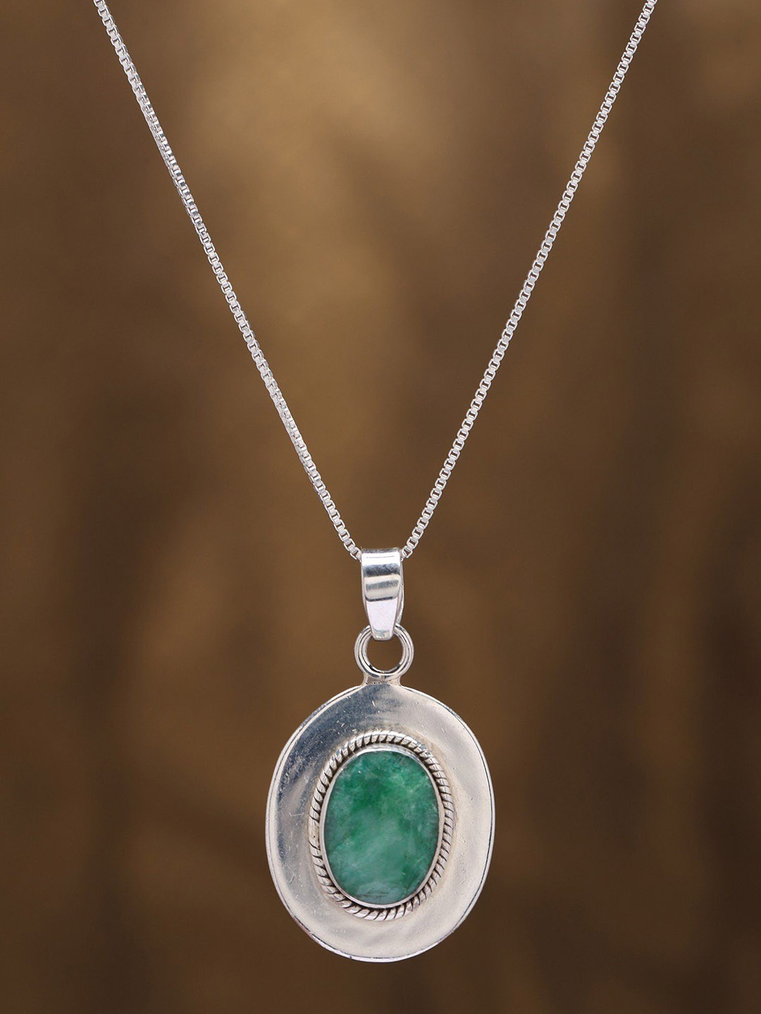 

Exotic India Sterling Silver Pendant with Faceted Oval Shape Emerald, Green