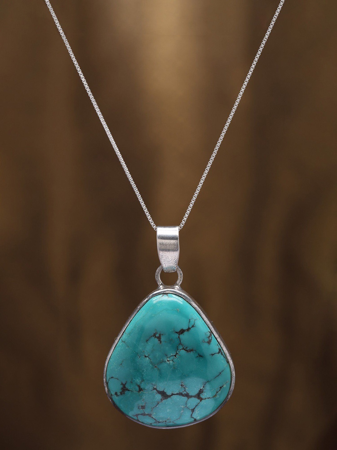 

Exotic India Sterling Silver Triangle Pendant with Tibetan Turquoise, Turquoise blue