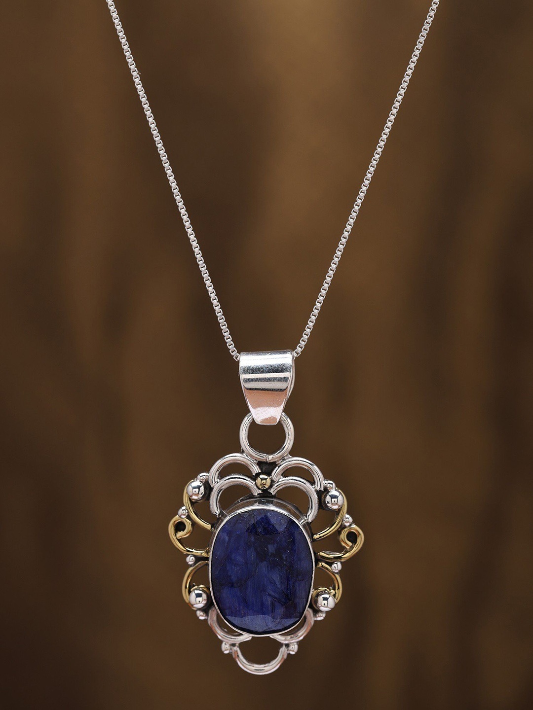 

Exotic India Vintage Style Sterling Silver Pendant with Faceted Blue Sapphire