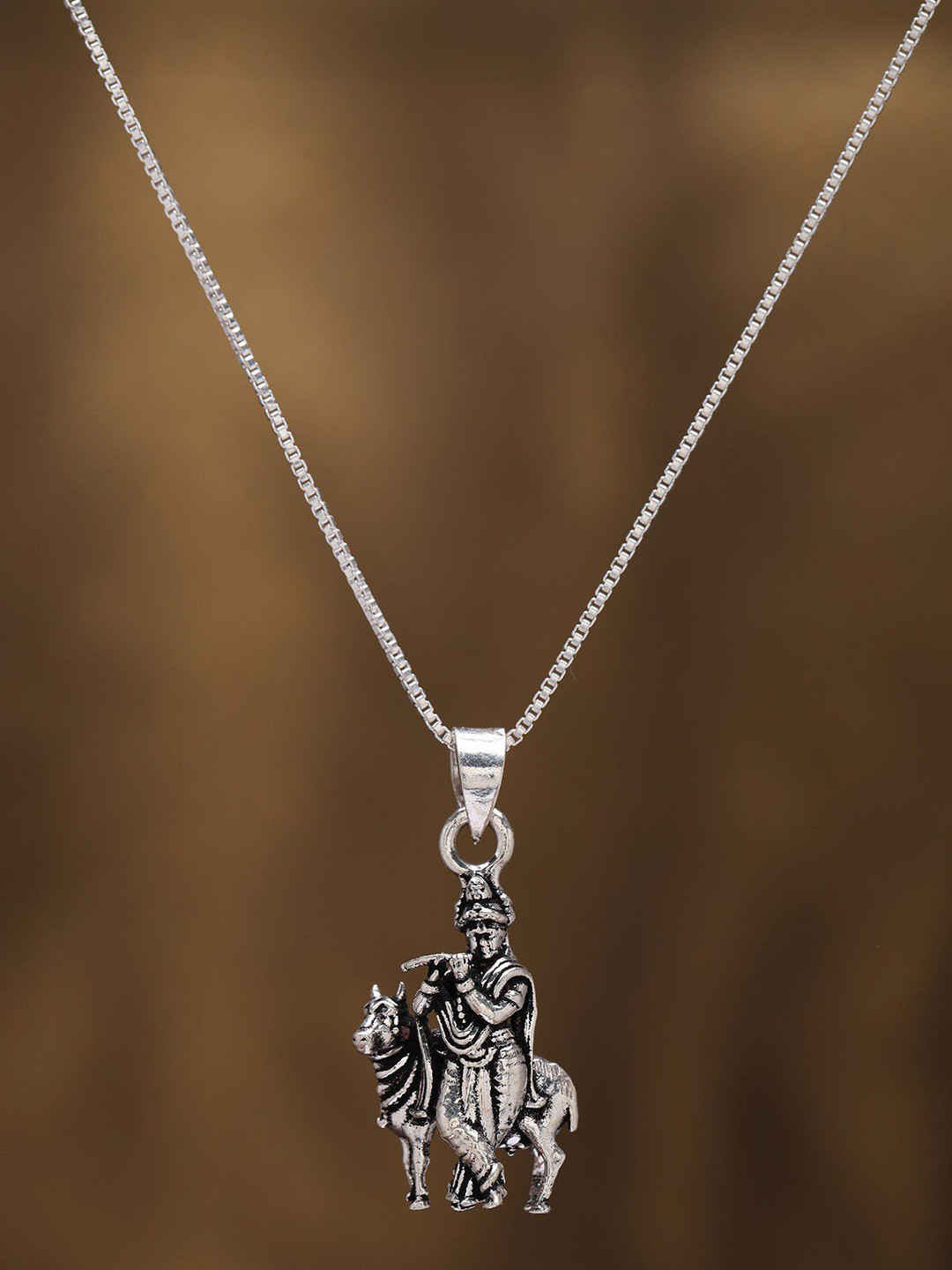 

Exotic India Sterling Silver Fluting Lord Krishna Pendant
