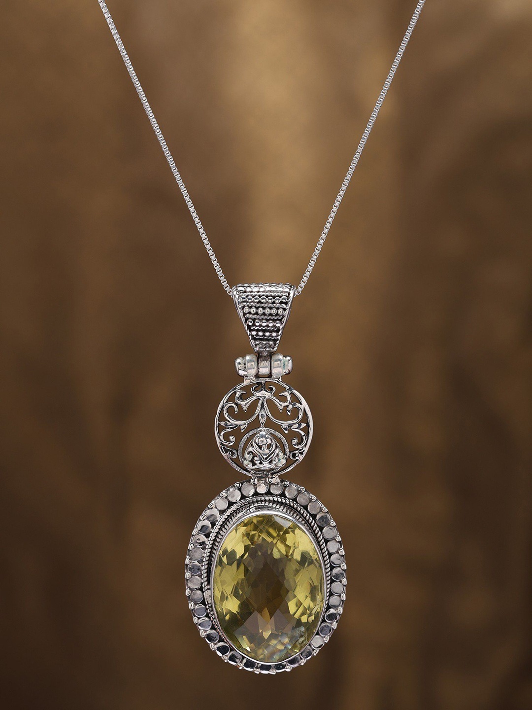 

Exotic India Faceted Oval Shape Lemon Quartz Pendant in Sterling Silver, Yellow