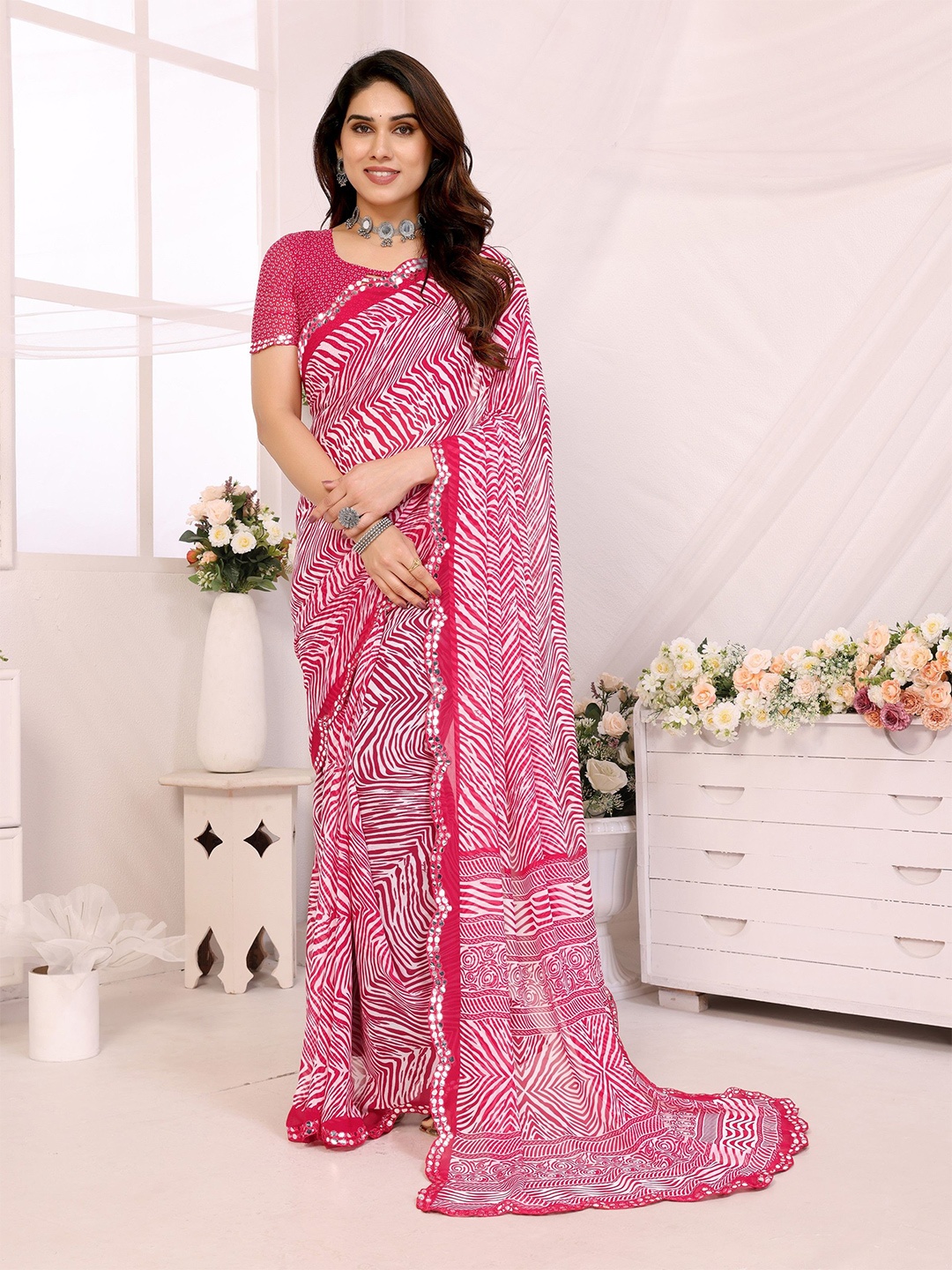 

Ambuja International Geometric Printed Mirror Work Pure Georgette Saree, Pink
