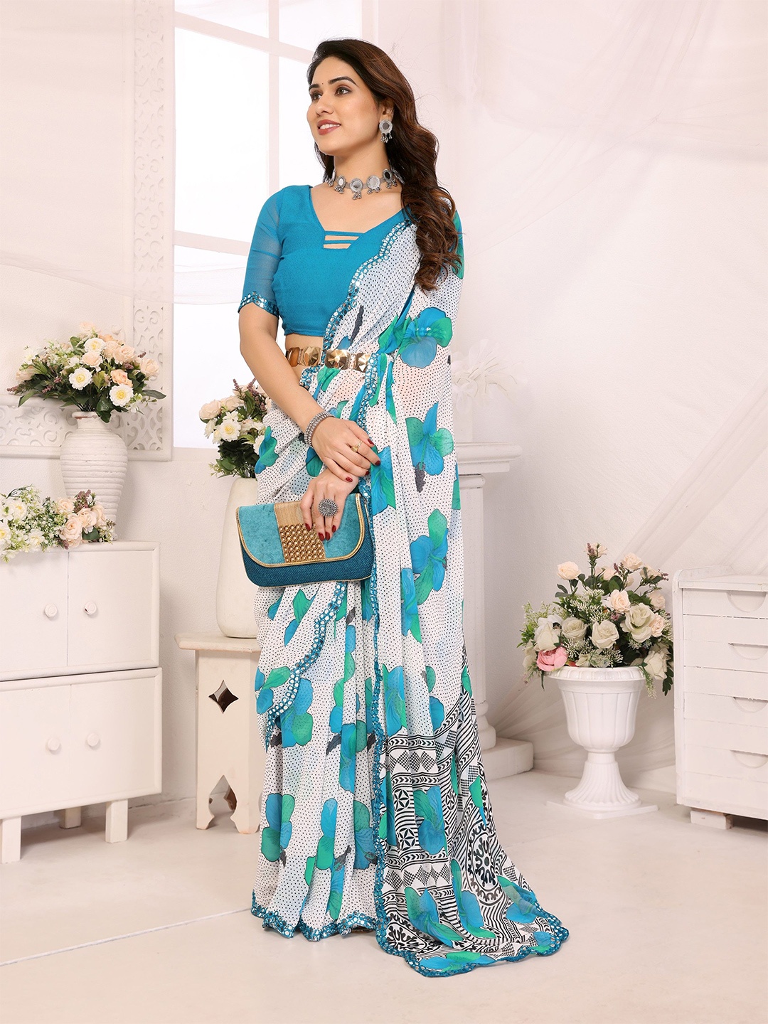 

Ambuja International Floral Printed Mirror Work Pure Georgette Saree, Sea green