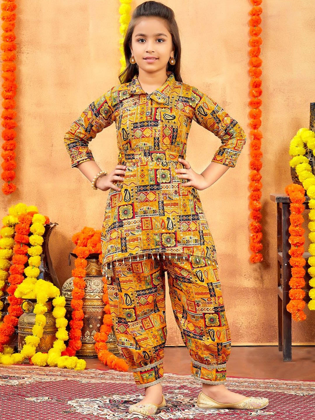 

Aarika Girls Paisley Printed Regular Pure Cotton Kurti with Trousers, Mustard