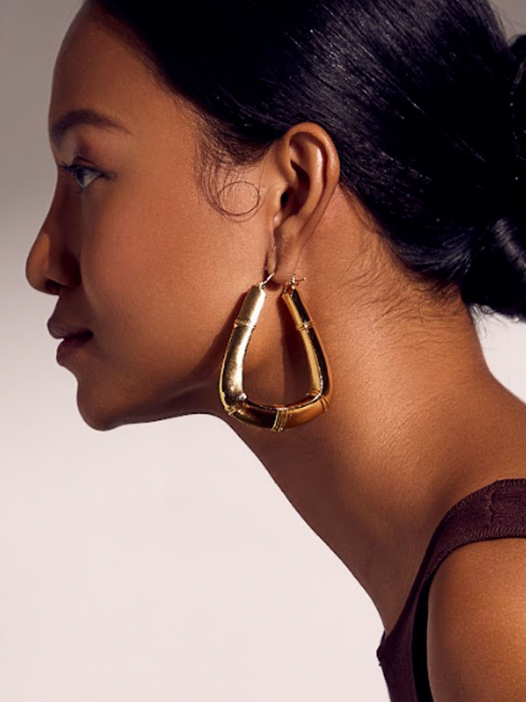 

Ethnic Andaz Gold-Toned Contemporary Hoop Earrings