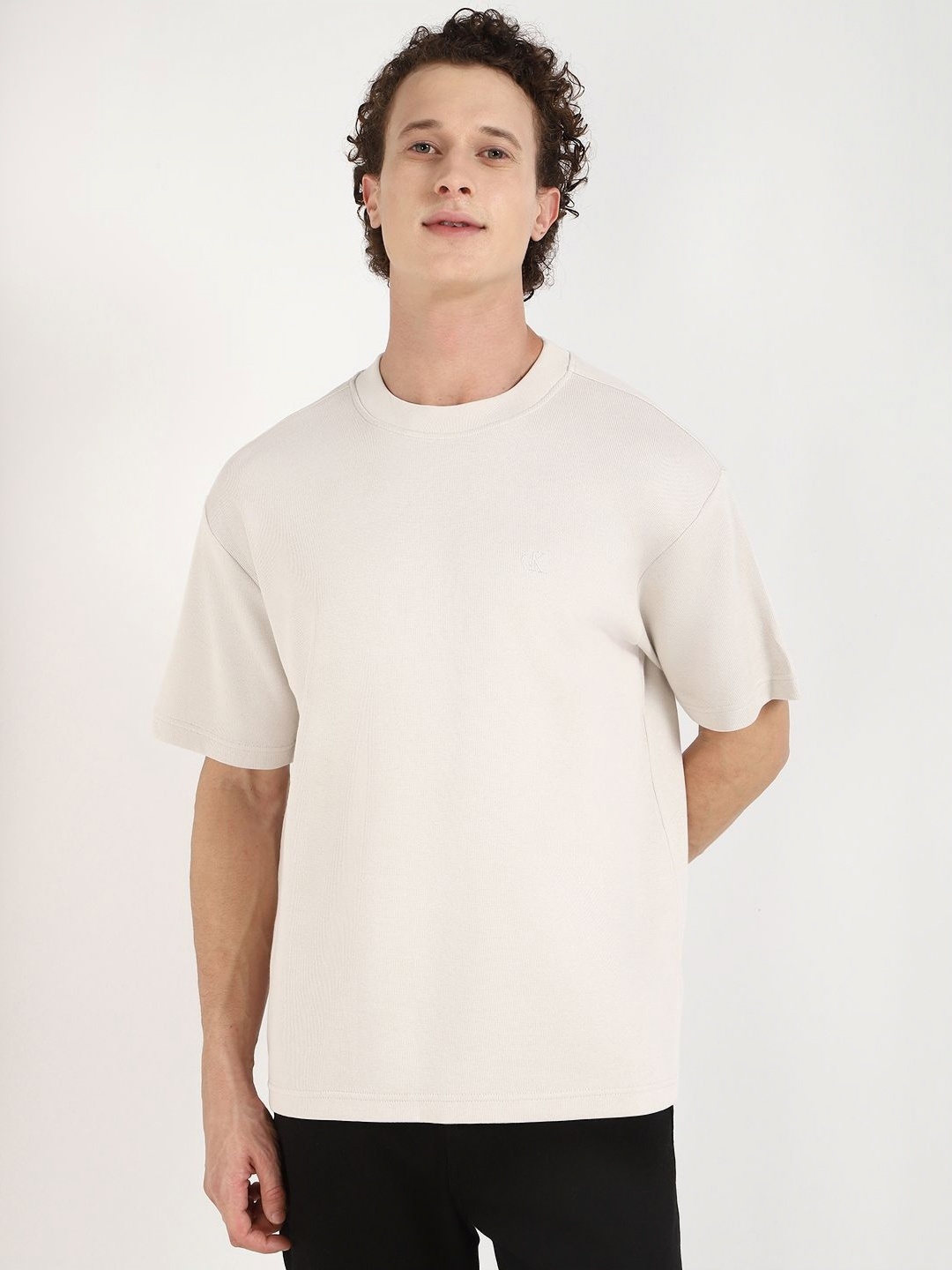

Calvin Klein Jeans Men Self Design Round Neck Cotton Relaxed Fit T-shirt, Off white
