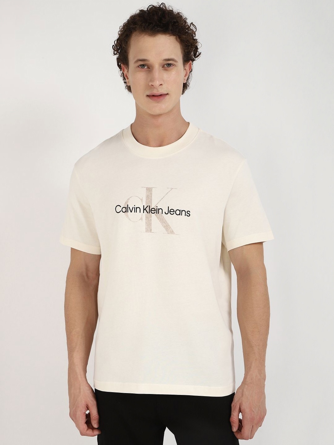 

Calvin Klein Jeans Men Typography Printed Round Neck Cotton T-shirt, Off white