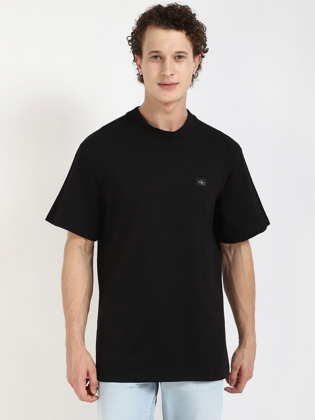 

Calvin Klein Jeans Men Solid Round Neck Cotton Relaxed Fit T-shirt, Black