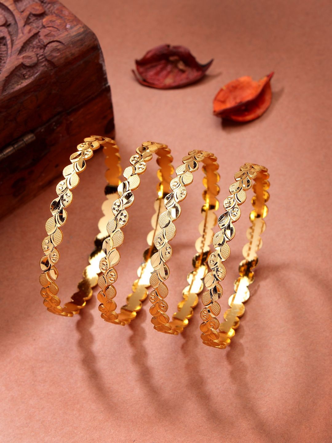 

NVR Women Set of 4 Gold-Plated Leaf Shaped Traditional Bangles