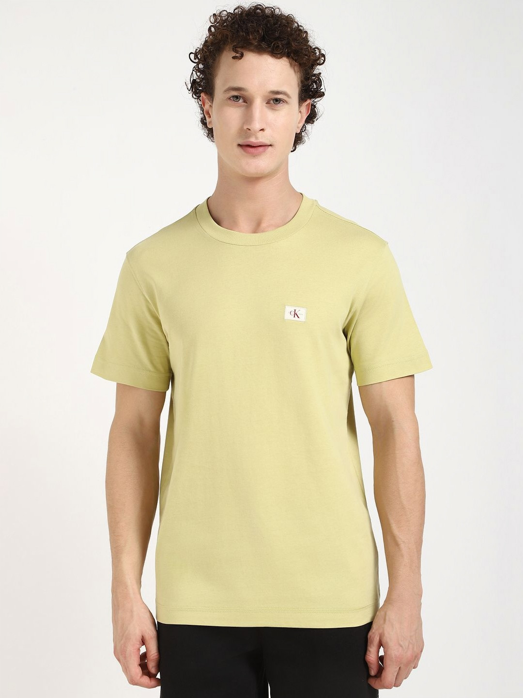 

Calvin Klein Jeans Men LABEL Solid Round Neck Cotton T-shirt, Yellow