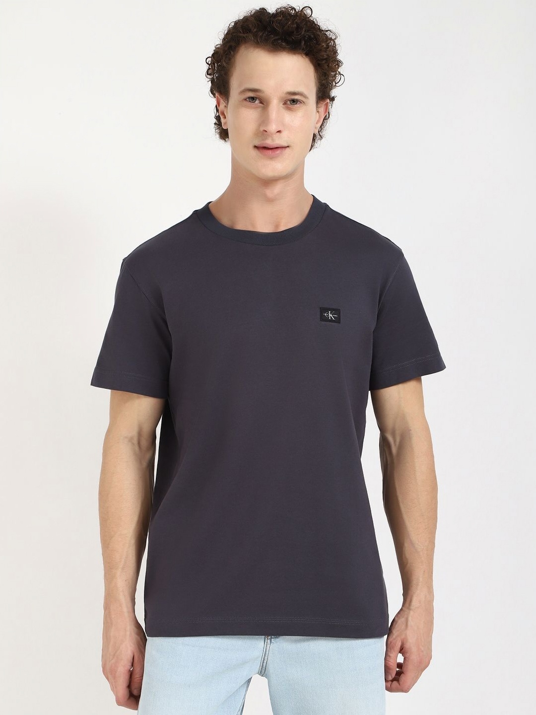 

Calvin Klein Jeans Men Solid Round Neck Cotton T-shirt, Charcoal