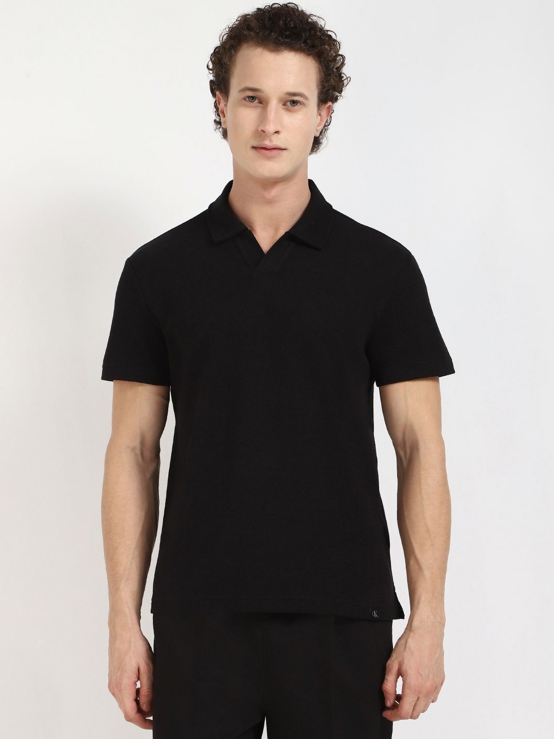 

Calvin Klein Jeans Men Self Design Polo Collar Cotton T-shirt, Black