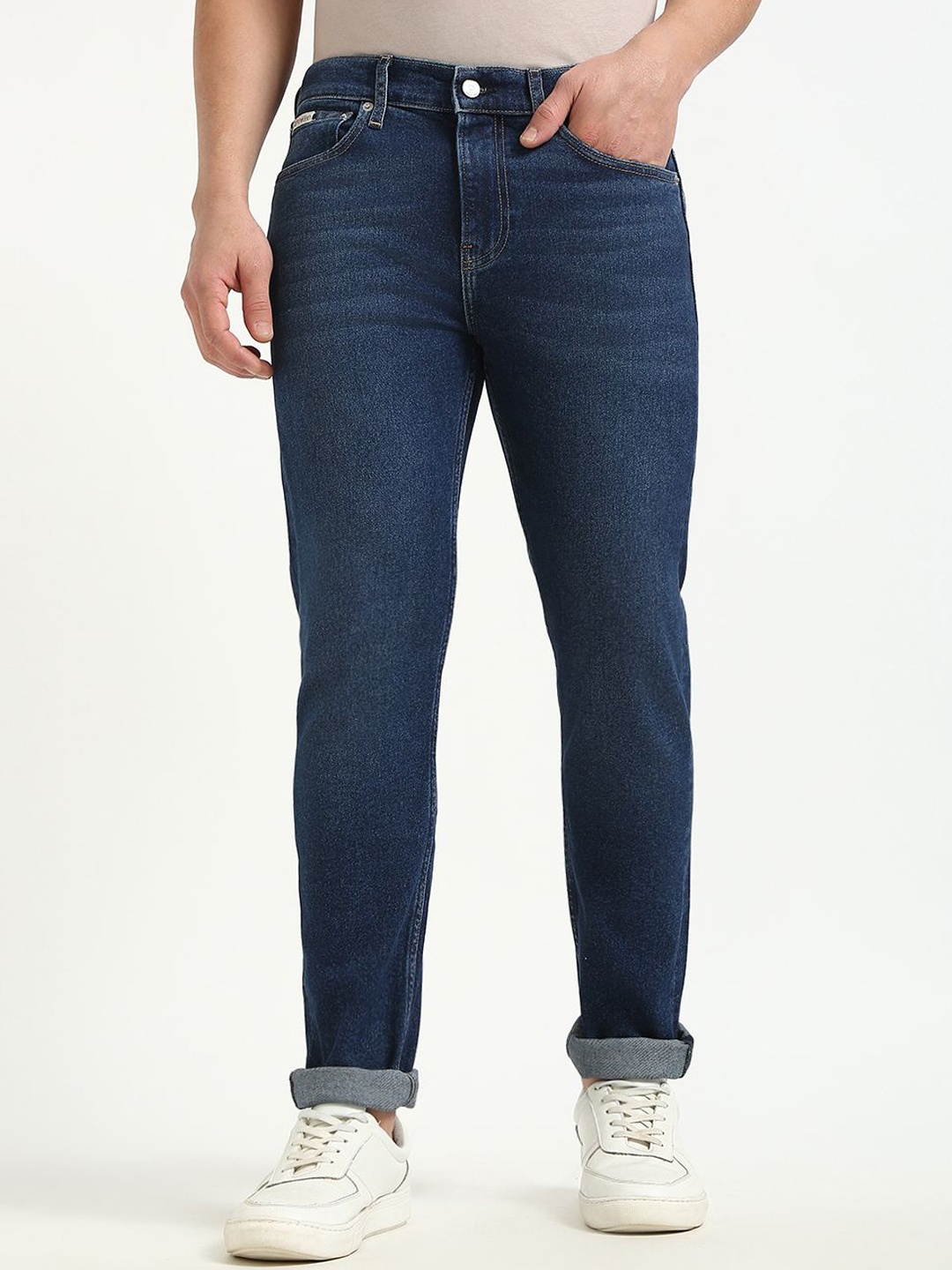 

Calvin Klein Jeans Men Tapered Fit Mid-Rise Jeans, Blue