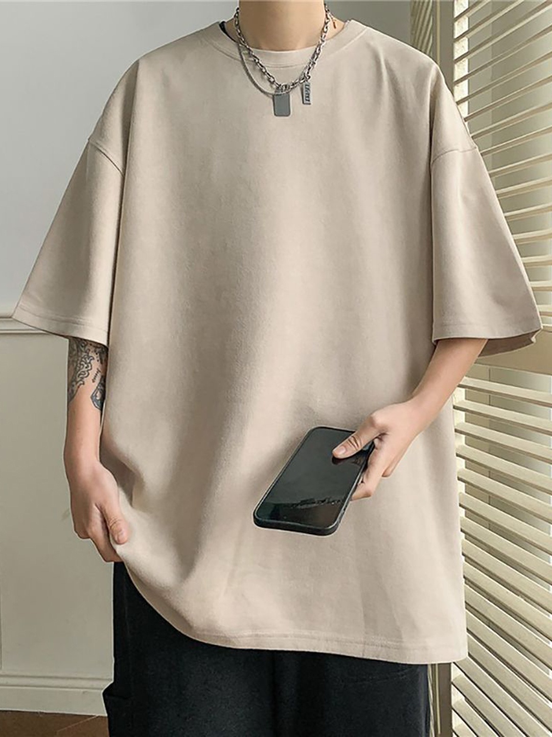 

StyleCast x Revolte Men Solid Round Neck Oversized T-shirt, Beige