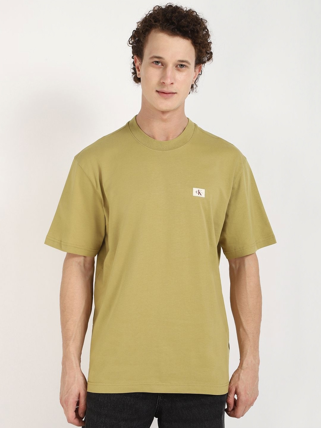 

Calvin Klein Jeans Men Solid Round Neck Cotton Relaxed Fit T-shirt, Yellow