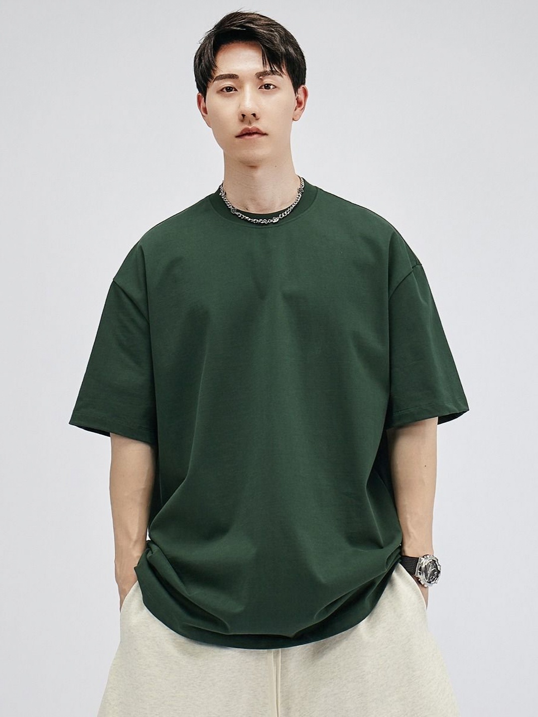 

StyleCast x Revolte Men Solid Round Neck Cotton Oversized T-shirt, Green