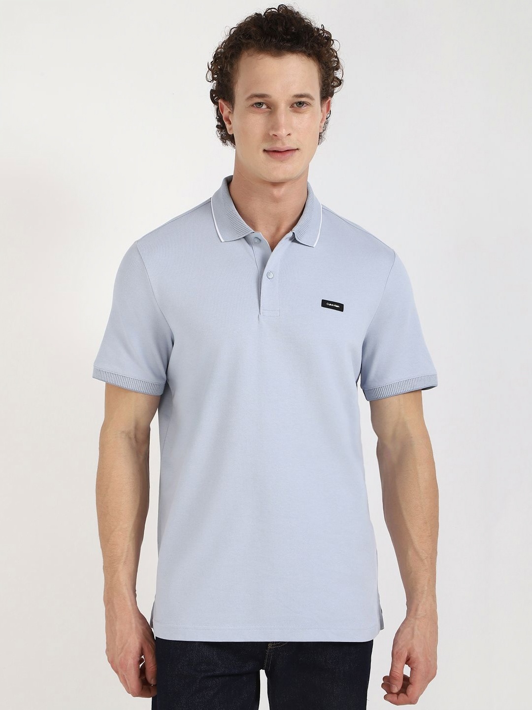 

Calvin Klein Jeans Men Solid Polo Collar Cotton T-shirt, Blue