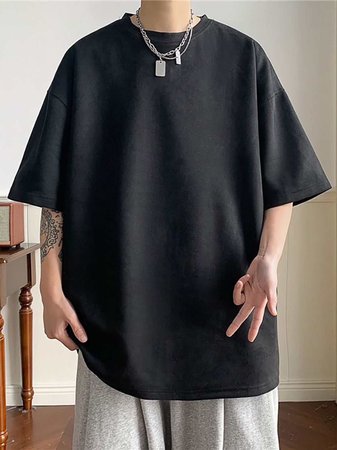 

StyleCast x Revolte Men Solid Round Neck Oversized T-shirt, Black