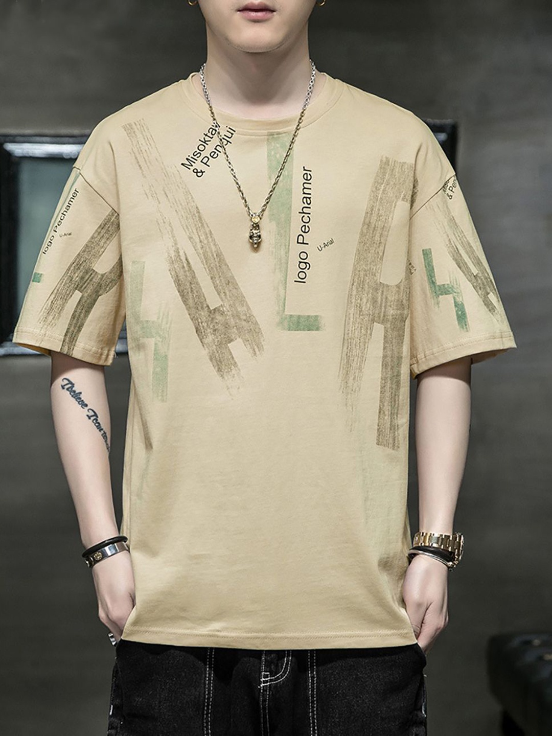 

StyleCast x Revolte Men Typography Printed Round Neck Cotton Relaxed Fit T-shirt, Beige